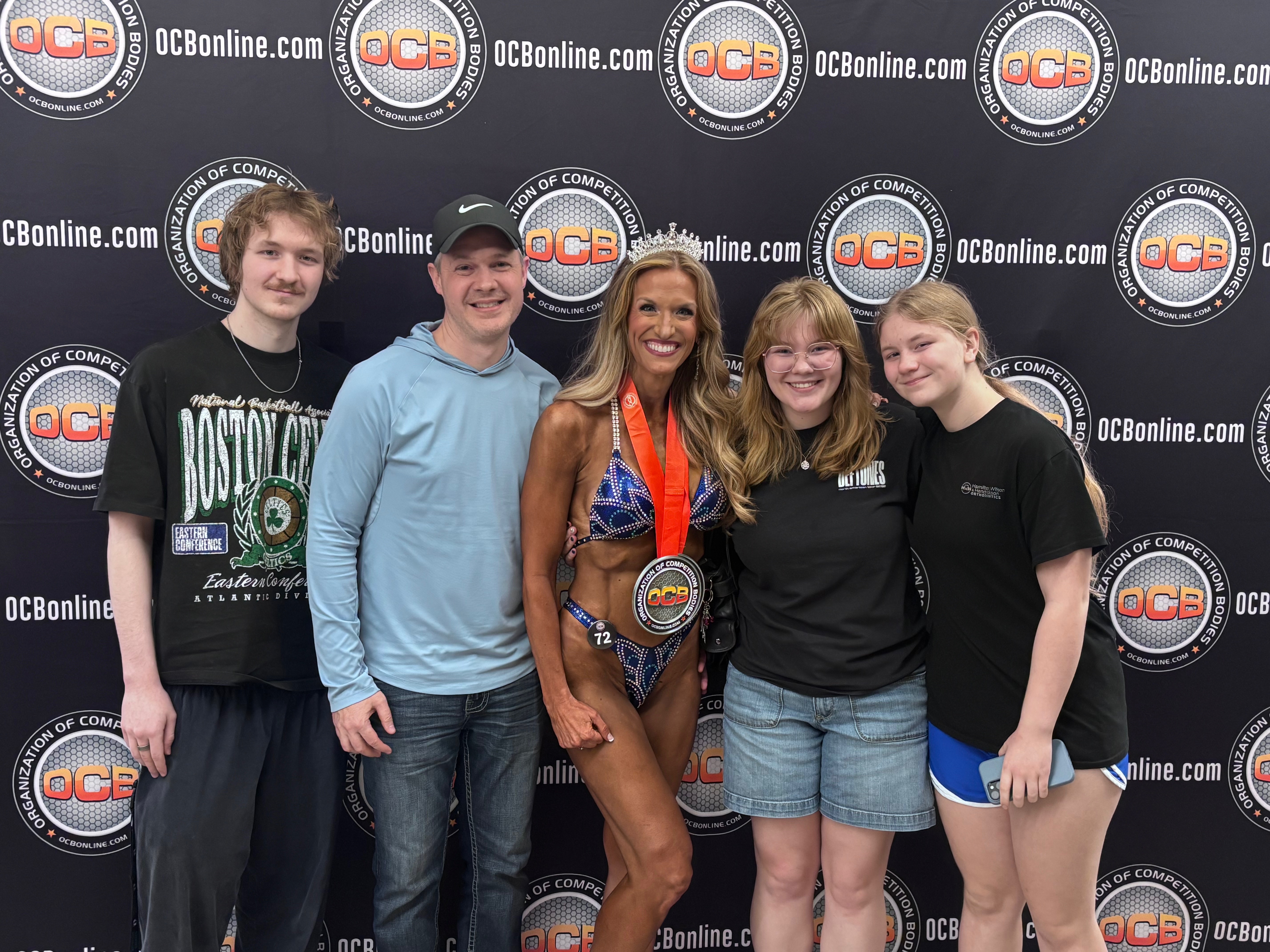 Kara with her family at her bodybuilding competition